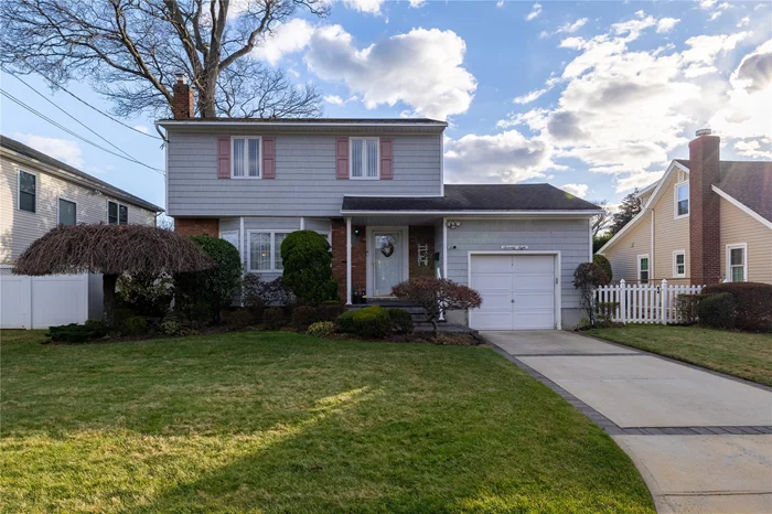 Welcome to this charming colonial home in the heart of Massapequa, where classic design meets modern comfort!This beautiful 3-bedroom, 1.5-bathroom residence boasts timeless red oak hardwood floors throughout the first and second levels, adding warmth and elegance to every room. The large kitchen features stainless steel appliances and ample counter space, perfect for hosting family and friends. Adjacent to the kitchen, leads to the dining room and a family room offering the ideal setting for memorable celebrations. The home also includes a full finished basement, providing versatile space for recreation, a home office, additional storage with Outside Entrance (OSE) A full attic and 1-car garage further enhance the home&rsquo;s practicality. Enjoy outdoor living on the spacious covered porch, overlooking a well-maintained yard thatâ€™s perfect for relaxing or entertaining. Close proximity to shops and the train station; several express trains for anyone looking for an easy commute.