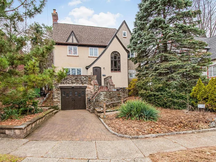 Stone and Stucco Tudor gem on lovely street in Historic Park Hill. Open air stone deck welcomes you at the front door. Inviting entry foyer boasts incredible two story Palladian window. Main level floor plan is perfect for entertaining. Oversized living room features wood burning fireplace & seamless flow to adjoining formal dining room. Bright, white kitchen with classic design features subway tile, granite counters, amazing prep space, gas range, farmhouse sink, pantry closet, eat-in area, and easy access to rear patio. Second level offers large primary with private bath featuring stand up shower. Two additional bedrooms and hall bath with soaker tub. Laundry, utilities and plenty of open storage on lower level. Additional attic storage. Rear yard offers patio area, garden area and plenty of outdoor entertaining space. Hardwood floors throughout, One-car garage. Sidewalk Neighborhood-Park Hill Swim/Racquet Club-Hudson Line Railroad to NYC- Close to local shops, grocery, medical