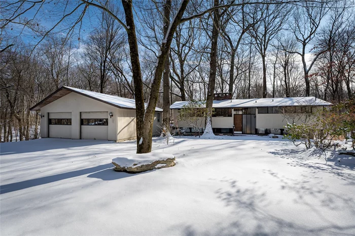 Escape to tranquility in this 4-bedroom, 2-bath Raised Ranch, perfectly situated on a quiet, tree-lined cul-de-sac. The main level welcomes you into a spacious living room, where a striking stone wood-burning fireplace takes center stage, flanked by three sets of sliding glass doors that lead to a wraparound deck, creating a seamless indoor-outdoor flow. Adjacent is a formal dining room, also with deck access, perfect for entertaining, and a well-appointed kitchen that completes the heart of the home. Down the hall, two sunlit bedrooms and a full hall bath offer comfort and convenience. The walkout basement provides even more living space, featuring a spacious family room with a second stone wood-burning fireplace, two additional bedrooms, a full bath, and a separate laundry area. A detached 2-car garage adds storage and practicality. This home is ideally located near nature preserves, a town park, Pound Ridge Tennis Club, Scotts Corners, and New Canaan. A true sanctuary with every amenity for modern living!