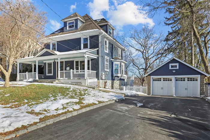 This beautifully updated Colonial, located on a picturesque street just minutes from the Village, combines classic charm with modern convenience. The inviting wraparound porch sets the tone for the warmth and character found throughout the home. Inside, you will find attractive details such as pocket doors, crown & baseboard moldings, wainscoting, built-ins and wood floors. The heart of the home is the stunning light-filled kitchen, designed to be both functional and welcoming. It features cozy window seating, a large central island, and sliding doors that lead to a spacious deck, perfect for entertaining. Access to the mudroom provides additional convenience. The sunny dining room with bay window opens to the front living room with built-ins and fireplace. The second floor boasts a private primary suite with beautiful bath and walk-in closet. There are three additional generously sized bedrooms and a tastefully updated hall bath. A walk-up attic with cedar closet and two rooms offers potential for expansion or additional storage. The finished walk-out lower level offers even more living space with a recreation/lounge area, full bath, laundry room with stainless sink, and ample storage. Enjoy the outdoors in the level, fenced-in backyard, ideal for play, gardening, or simply relaxing. The property includes a two-car detached garage, adding both convenience and extra storage space. A whole house generator completes the package. This home is truly a rare find, blending timeless appeal with contemporary updates, and a fantastic location near shops, train, restaurants and more.