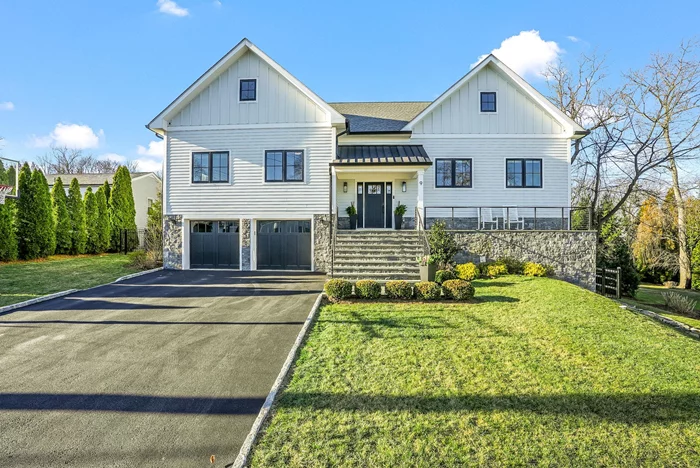 This stunning Rye Gardens property showcases modern elegance & luxurious outdoor living. Recently renovated & expanded, it features a white farmhouse-style fa&#231;ade accented by stonework & contrasting black finishes. This inviting living space seamlessly combines style & function w/abundant natural light flowing through oversized windows. Open-concept design includes a LR w/sleek fpl and a built-in wet bar, opening to the dining area and the gourmet kitchen, which boasts a lg waterfall island, state-of-the-art appliances, custom cabinetry & doors to deck. Spacious primary bdrm is a serene retreat, featuring a lg WIC & luxurious ensuite bth w/dbl vanity, glass-enclosed shower & modern tile finishes for a spa-like experience. Beautifully designed baths throughout the home offer a blend of elegance & modernity, featuring marble countertops, sleek fixtures & custom vanities. The expansive 3rd floor w/vaulted ceilings, exposed beams, natural light & full bath offer flex space with unlimited potential - rec rm, office, guest suite & more. The LL boasts another versatile living area w/5th bdrm w/ensuite bth, rec room w /full bth, a home gym that opens to the backyard. lndry rm/mudroom & access to the 2-car garage w/epoxy flooring, custom cabinetry & storage. The beautifully landscaped yard highlights a private backyard oasis complete w/sparkling pool, an expansive patio & a deck perfect for outdoor dining and entertaining.