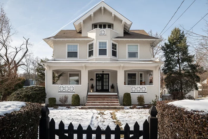 BROADWAY BEAUTY - Step into a world of timeless elegance with this meticulously restored circa 1902 Arts & Crafts Colonial, located on one of Nyack&rsquo;s most coveted streets at 198 North Broadway, Nyack, NY. This extraordinary residence combines historic charm with modern comforts, offering over 4, 000 square feet of living space, including a finished basement. Nestled on a half-acre of level, manicured grounds, this home is a sanctuary of character and craftsmanship, just 35 minutes from NYC and moments from the Hudson River and Nyackâ€™s vibrant downtown. As you approach the property, the expansive rocking-chair front porch invites you to savor serene mornings with coffee or lazy afternoons, basking in the quiet beauty of this iconic riverfront village. The grounds themselves are a gardener&rsquo;s dream, featuring a striking bluestone patio, multiple seating areas, and lush landscaping that creates a magical setting for al fresco dining and year-round enjoyment. Inside this masterpiece, the home unfolds with impeccable attention to detail. The grand entry foyer sets the tone with its warm and inviting ambiance, leading to a formal living room adorned with coffered ceilings and stained glass windows. Adjacent, a stunning library showcases breathtaking custom millwork, original pocket doors, and built-in wood panels, providing a perfect space for reading, reflection, or intimate gatherings. The formal dining room exudes charm with its built-in cabinetry and cozy wood-burning fireplace, ideal for hosting special occasions. The updated chef&rsquo;s kitchen is both functional and delightful, boasting a breakfast nook with a built-in bench, two pantries, a Sub-Zero refrigerator, and ample counter space to inspire culinary creativity. The upper levels of the home offer versatile and luxurious living with spacious accommodations and river views. The top two floors offer four bedrooms, three full baths, and a sunlit home office overlooking North Broadway and the majestic river. The primary suite is a retreat unto itself, complete with a dressing room, walk-in closet, and a spa-like en suite bathroom featuring a Jacuzzi tub and separate shower. A third-floor suite offers a unique haven with its full bath, expansive space and private outdoor porch, perfect for use as an additional bedroom, guest quarters, or a second home office, all while capturing breathtaking views of the Hudson River. The finished basement provides a generous family room/bonus space, a full-sized laundry room, and an additional bath. A two-car detached garage and parking for six cars ensure ample space for residents and guests. This home is the epitome of modern comfort in a timeless setting with conveniences including central air conditioning and a whole-house generator, seamlessly blending with the homeâ€™s historic charm. This gracious turn-of-the-century classic offers not just a home, but a lifestyle, where every detail has been thoughtfully curated. From the enchanting grounds to the exquisite interior detail, this property is a quintessential Nyack treasure. Discover the perfect blend of historic allure and contemporary luxury in a location that offers the best of village living, just a stone&rsquo;s throw from the Hudson River.