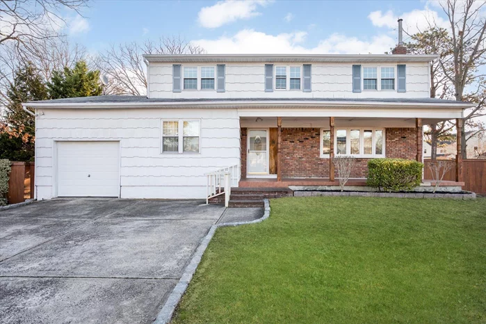 Spacious 5-Bedroom Wideline Colonial in Farmingdale Schools. Welcome to this expansive 5-bedroom, 2-bath colonial, on a generous 100x100 lot. This home features newly refinished wood floors throughout, creating a warm and inviting ambiance.The kitchen offers classic charm with real wood cabinets, stainless steel appliances, and easy access to a large backyard, perfect for entertaining or relaxing.The main floor includes a spacious 18x13 ft bedroom and a main floor full bath, ideal those that seek a ground floor bedroom. Upstairs, youâ€™ll find four large bedrooms, including a stunning 21x12 ft primary bedroom with two walk-in closets and a shared full bath.This property also includes a full finished basement, providing ample space for recreation, storage, or additional living areas.