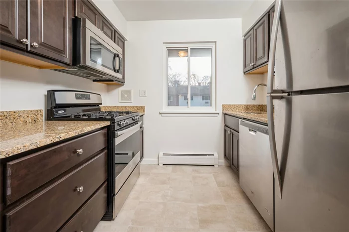 Bright, beautiful, and move in ready! You will love this pretty upper one bedroom unit in Blue Hill Commons. Large rooms with gleaming hardwood floors and all freshly painted. Kitchen features gorgeous wood cabinets, granite countertops an stainless appliances. Lots of closet space and just steps away from parking. Utilities all included in HOA fee.Come see this one for yourself!