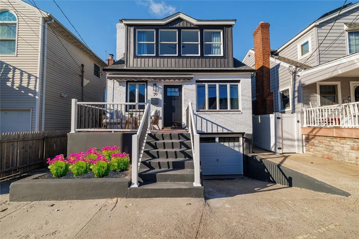 Welcome to this stunning, gut-renovated gem in coveted East Atlantic Beach! Impeccably designed and in platinum condition, this home offers the perfect blend of modern luxury and coastal charm. Step onto the charming front porch and into a spacious, open-concept living area with a statement fireplace â€” ideal for relaxing or entertaining. Featuring a chefâ€™s eat-in kitchen with stainless steel Energy Efficient appliances and Alexa-Ready Switches, radiant heat floors in both baths, and high-end finishes throughout. The lower level, with its own private outside entrance (OSE), provides additional space and a garage. Enjoy summer days in the outdoor shower or take a short stroll to your private beach. Rest easy with low and transferable flood insurance (-$1, 100) and low taxes, and easy access to local shopping and dining. This pristine home is ready to offer you a lifestyle of luxury and convenience. Because life is better at the beach!