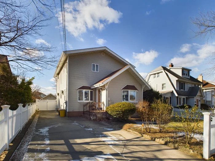 Experience the timeless appeal of 63 Sunset Avenue, a Colonial-style gem in the Lynbrook School District. Built in 1925, this 2, 020 sq. ft. home offers 5 bedrooms, 3 baths, and stunning hardwood floors. Set on a beautifully landscaped 10, 441 sq. ft. lot with an above-ground pool, itâ€™s perfect for outdoor enjoyment. The living room features a decorative fireplace and stained-glass windows, while the formal dining room and recently updated eat-in kitchenâ€”boasting quartz countertops and stainless steel appliances. Relax in the sunporch or retreat to the primary bedroom with cathedral ceilings, a custom walk-in closet, and an ensuite bath. The partially finished basement provides laundry, utilities, and extra storage. Additional features include a detached garage, private driveway, dual heating (gas and oil), 5 AC units, and a 2-zone sprinkler system. Conveniently located near the LIRR and shopping, this home blends historic charm with modern comfort.