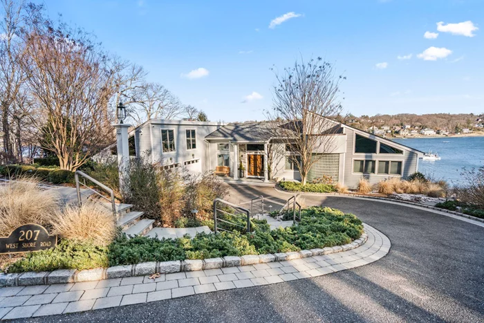 The main floor welcomes you to a grand living room overlooking the water with high ceilings, a dramatic floor-to-ceiling stone wood-burning fireplace, a built-in bar, and Andersen sliding glass doors that open to a beautiful back deck, seamlessly blending indoor and outdoor living. This perfectly flows into the kitchen which boasts high-end stainless steel appliances, a wet bar, large windows that frame the stunning harbor views, and direct access to the back deck for easy entertaining. The first-floor primary bedroom features two large walk-in closets, tranquil harbor views, and an ensuite bath. Two additional bedrooms on this level each include large walk-in closets and share a Jack-and-Jill bath. The lower level is a versatile retreat, perfect for recreation and relaxation. A cozy family room with a wood-burning fireplace and sliding glass doors to an outdoor hot tub. While the â€œHarbor Roomâ€ is an entertainerâ€™s delight, complete with a wet bar, custom cabinetry, and sliding glass doors that lead to the â€œEndless Poolâ€ lap pool and amazing harbor views. This level also includes two additional bedrooms with walk-in closets, 2 full baths, an exercise room, and laundry room.Additional features of this remarkable home include a heated two-car garage with a full staircase to a spacious attic, a whole-house Automatic Generac generator, a central vacuum system, and security system. Outside, the professionally landscaped backyard is a private oasis featuring Trex decking, equipped with 2 heat lamps under a motorized roll-out awning, build in BBQ on a stone island, drink refrigerator and an Endless Pool lap pool and a hot tub.Offering breathtaking harbor views, thoughtfully designed indoor and outdoor spaces, and an array of premium features, this property is more than a homeâ€”it&rsquo;s a sanctuary.