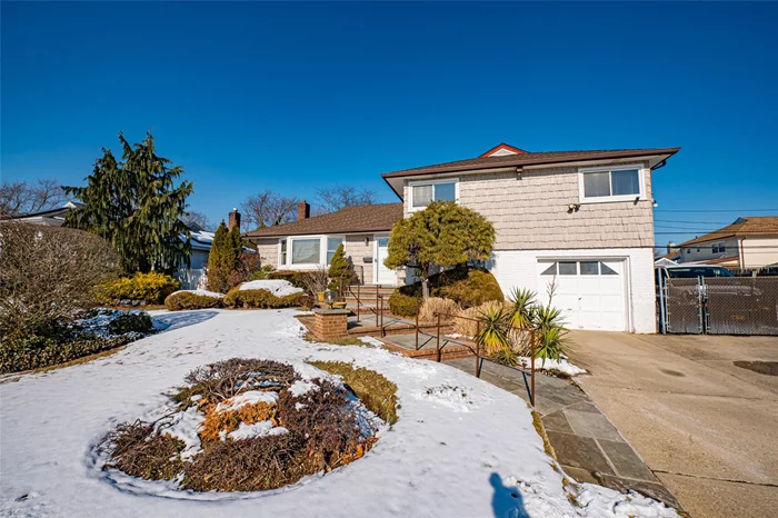 Drive down this impeccable block in North Massapequa and stop at #215. This split level home offers a blend of classic design and inviting curb appeal. The exterior is adorned with well maintained landscaping, a lush green lawn and a welcoming entrance. The interior reveals an opportunity for modern updates and personal touches. Enter into a large sunlit living room open to a formal dining room perfect for family gatherings. Eat-in kitchen with plenty of cabinets and a door leading to your huge outside deck for BBQ&rsquo;s and entertaining. The upper level has a very large primary bedroom en-suite, and 2 additional good-sized bedrooms and an updated full bathroom. A lower level with den, room for an office, ample storage, laundry area and garage entrance. Basement with utilities and tons of storage. Central A/C, gas cooking, roof 10yrs new. Perfectly located near to Southern State Pkwy, shops, restaurants and schools. Award winning Plainedge SD.