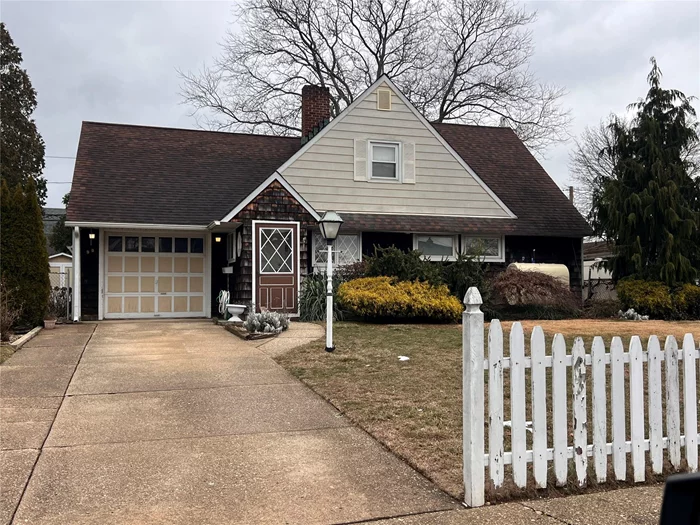 Step into this spacious 4-bedroom, 1.5-bath, 1, 290-square-foot expanded ranch in Levittown! The first floor features a welcoming vestibule entrance leading to an eat-in kitchen with a dishwasher, a formal dining/living room with a wood-burning fireplace, and a den/family room with wall AC and a closet. The extended master bedroom offers a large closet, while an additional bedroom doubles as a home office. A bright rear sunroom with two skylights, a tiled full bathroom, and ample living space complete the main level. Upstairs, youâ€™ll find a large bedroom with wall AC, storage eaves, and overhead lighting, a second bedroom with a closet, a half bathroom, and a large unfinished attic. Additional features include updated windows, a new 275-gallon above-ground oil tank, a 14-year-old boiler with 2-zone heating, a 1.5-car garage with a separate laundry room, and a private fenced backyard with PVC fencing and a shed.