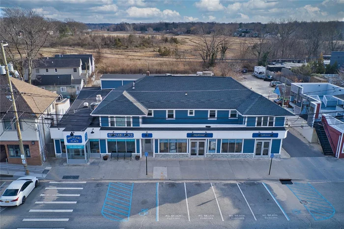 This mixed-use property offers a solid investment opportunity with fully leased residential and retail spaces. The attractive water views and high demand in the area ensure long-term tenant retention and rental growth. 10 Residential Units with 2 Ground Floor Tenants with Front and Rear Entrance. The Property Includes a rear parking lot. The building has been fully updated in 2019.