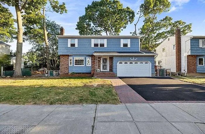 Welcome to your dream home! This stunning two-story colonial residence perfectly blends traditional elegance with modern comforts, situated in the highly sought-after neighborhood of Massapequa. As you approach this lovely home, youâ€™ll be greeted by its classic faÃ§ade and a beautifully manicured front yard, setting the tone for what lies within. Step inside to discover a spacious living room bathed in natural light from large windows that frame picturesque views of the outdoors. The warm ambiance is enhanced by gleaming hardwood floors that flow seamlessly throughout the main level. Whether youâ€™re hosting gatherings or enjoying quiet evenings at home, this inviting space is perfect for all occasions. The heart of this home is undoubtedly the eat-in kitchenâ€”a culinary haven featuring ample counter space and cabinetry for all your cooking needs. Adjacent to the kitchen is a cozy living room where cherished memories will be made, providing an ideal spot for relaxation and entertainment. Retreat upstairs to find a luxurious primary bedroom that boasts an en-suite bathroom and a thoughtfully designed built-in closetâ€”your personal sanctuary awaits! The second floor also features a newly renovated bathroom that exudes modern sophistication, ensuring comfort for everyone. But thatâ€™s not allâ€”this property offers a newly renovated full finished basement that provides endless possibilities! Transform it into a game room, home office, or additional living space; the choice is yours. Step outside into your expansive backyard oasis, perfect for summer barbecues or serene evenings under the stars. With plenty of space for outdoor activities and gardening, this backyard truly enhances your lifestyle. Completing this exceptional property is a two-car garage providing convenience and additional storage options. With a new roof ensuring peace of mind for years to come, this home stands ready for its next chapter. Donâ€™t miss out on this rare opportunity to own such an exquisite colonial gem in Massapequa!