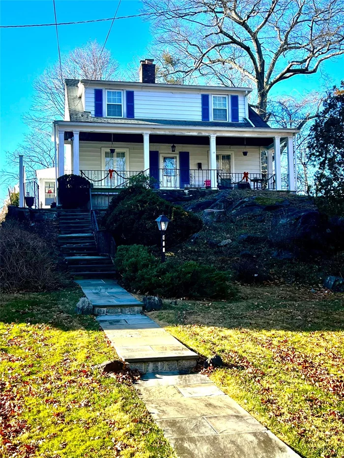 A Classic charming 1927 Colonial home in Historic Peekskill, NY situated in the heart of Peekskillâ€™s historic district with breath taking views of the Hudson River. Walk up the steps to a porch spanning the full width in front of the home. A perfect space to relax and enjoy the peaceful neighborhood. Southern pine flooring throughout the first floor, spacious living room with an extended sitting area, wood-burning fireplace for cozy evenings, Eat-in kitchen with a stainless-steel appliance inclusive of a gas stove, refrigerator, dishwasher. Elegant Dining Room perfect for entertaining, mudroom off the kitchen and located directly behind the kitchen, a heated sunroom features large windows that overlook the backyard and partial views of the Hudson River, perfect for relaxing or a bright workspace. 2nd floor: 4 bedrooms (4th bedroom ideal for nursery or home office), full bath with a stylish pocket door. Wall air conditioners, easy access basement includes washer and dryer and storage space. Two-car driveway. A prime location to the Peekskill train station is a commuter rail stop on the Metro-North Railroad&rsquo;s Hudson Line, the closest train station from West Point heading to NY city. Enjoy the famous Westchester County Landmark at The Paramount Theater. Up the hill across the street, youâ€™ll find a beautiful park with tennis, pickleball courts, and a community pool. Come and experience the timeless charm, modern comforts, and an unbeatable location.