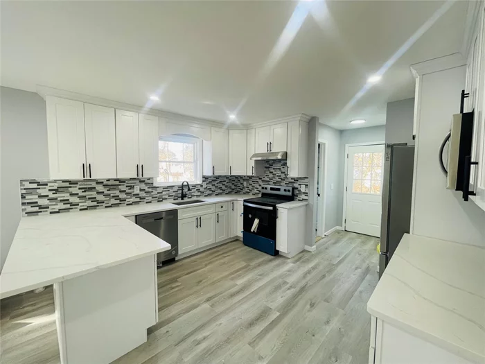 Fully renovated 4 bedroom, 2.5 baths, Full unfinished basement and 1 car garage on over a half-acre property.