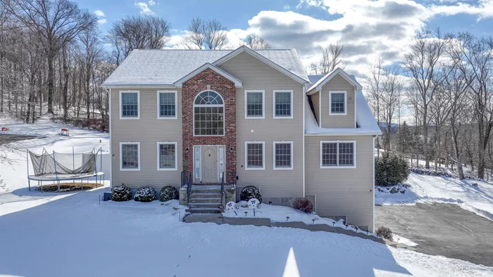 Located on a quiet dead-end road in a sought-after neighborhood, this stunning 4-bedroom Colonial offers both style and comfort. Step inside to a grand two-story entrance with arched entryways and hardwood floors throughout the first level. The kitchen features granite countertops, a center island with bar seating, pendant lighting, and an eat-in area with sliders that open to a spacious 16x24 deckâ€”perfect for hosting gatherings. The family room boasts vaulted ceilings and a cozy wood-burning fireplace with a custom mantle. An additional room off the family room offers versatility as a home office, reading nook, or playroom. The dining room and living room are enhanced with elegant crown molding, while a second bonus room currently serves as a home office. Powder room and laundry room on the main level. Upstairs, the expansive master suite features tray ceilings, a walk-in closet, and an ensuite with a jetted tub, dual vanity, and tiled shower. Three additional bedrooms, all with carpeting and ceiling fans, and an updated full bath complete the second level. Step outside to your backyard oasis. Relax or entertain by the 16x32 heated inground saltwater pool surrounded by a paver patio, complete with a custom outdoor fireplace. The fully fenced yard offers both privacy and tranquilityâ€”an ideal retreat after a long day. Additional features include central air, a 2-car garage, and a large driveway with ample parking. This home truly has it allâ€”donâ€™t miss the opportunity to make it yours! Washingtonville School District. Close to Newburgh Water Front offering great restaurants and local brewery. Under 10 mins to Stewart International Airport, 18 mins to Beacon Train Station, Close to I-84 and NYS Thruway - great commuter location!