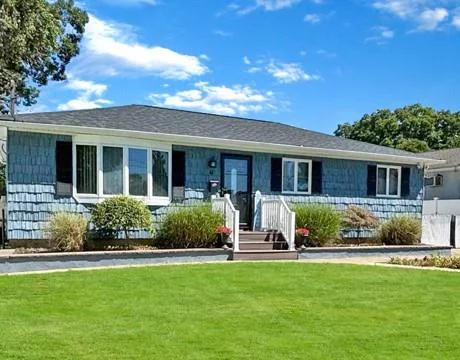 This meticulously maintained 4-bedroom, 2-bath ranch home is nestled on a quiet block and offers the perfect blend of modern upgrades and timeless comfort. At the heart of the home is the stunning, bright, and fully updated kitchen, enhanced by natural light from a skylight. With quartz countertops, farmhouse-style touches, shiplap accents, custom cabinetry, and stainless-steel appliances, this space seamlessly combines style and functionality.Throughout the home, youâ€™ll find beautiful hardwood floors, energy-efficient Anderson windows, central air, and a newly replaced roof designed for long-term durability. Additional highlights include generous storage options, a detached garage for entertaining, tastefully updated baths featuring a spa-like walk-in rain shower and custom vanity, laundry room and a full finished basement with separate private entrance.The flat, oversized park-like backyard is fully fenced for privacy and offers ample space for outdoor enjoyment. It includes an above-ground pool, ambient lighting, an inground sprinkler system and a giant fig tree. The fig tree is a low-maintenance addition that brings charm to the yard and produces an abundance of delicious figs throughout the season, perfect for all to enjoy. This home offers the perfect balance of modern upgrades and comfort, making it one-of-a-kind find for your next home.