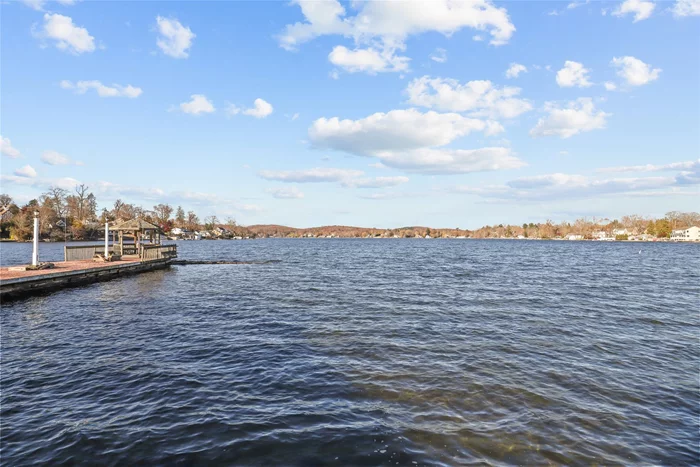 Discover a tranquil waterfront condo with million-dollar views of pristine LAKE MAHOPAC. This fully renovated, expansive top-floor unit at WHITE SAIL CONDOMINUMS features an ideal open-concept floor plan with 1-bedroom plus a versatile den/office. Breathtaking water views are visible from every point of the living space, bedroom, and the private balcony/loggia. The contemporary Chefâ€™s kitchen boasts a large breakfast island, stainless steel appliances, and sleek matte Dekton countertops, while the elegant bathroom offers a ceramic-tiled walk-in shower and custom built-in cabinetry. The generously sized bedroom showcases extraordinary lake views and ample closet space. Energy-efficient Pella windows and sliding glass doors bring in abundant natural light, and the unit includes a newer washer and dryer for added convenience. This condo shows as a two-bedroom. Waterfront amenities include a pool and lakefront promenade with gazebo, offering the perfect balance of elegance and serenity. Meticulously renovated in 2020, this condo is ideally situated for enjoying life on the lake while being only minutes from town restaurants, Chamber Park, library, shops, marinas, bike path, and more. Just 7 miles away from Croton Falls Metro North train station. This rare gem is an opportunity not to be missed!