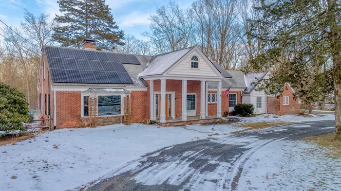 Just minutes from the heart of Stone Ridge, this charming 4-bedroom, 3-bath Cape-style home is nestled on 2.33 peaceful acres. With just under 3, 000 square feet of living space, the versatile layout offers endless possibilities to suit your lifestyle. Originally built in 1960, this custom-designed home was inspired by the elegance of a Southern ranch, featuring hardwood floors throughout and built-ins that beautifully frame the living room fireplace. Recent upgrades have enhanced the homeâ€™s charm, including a brand-new kitchen with stunning country-style cabinetry, sleek stainless steel appliances, an apron-front sink, and exquisite countertops. The first floor boasts two bedrooms, one of which serves as the primary suite, complete with a fully remodeled en-suite bath featuring heated floors. A formal dining room with direct access to the back deck overlooks the picturesque yard, where wildlife frequently roams. The main level also includes a full hall bath, a cozy den/family room, and the convenience of one-level living. Upstairs, youâ€™ll find two additional bedrooms and loft space, perfect for a home office, playroom, or gym. The home also comes with fully owned solar panels for energy efficiency. With so much to offer, this property is truly a must-see to appreciate its beauty and charm.