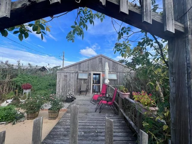 A Place For Us - an old-fashioned, beautifully remodeled, Two bedroom cottage, right on the Great South Bay. Vaulted ceilings, open kitchen/living and dinning area. Wonderful deck space with the best views of the Great South Bay! W/D, A/C Outdoor Shower!