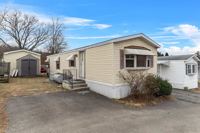 Discover the opportunity to own for less than the cost of renting in Carpenters Park, a vibrant 55+ community. This charming 2-bedroom mobile home features a spacious eat-in kitchen that seamlessly flows into the living area, along with a full hall bathroom and convenient laundry hook-up. Home needs some TLC but great potential. Shed included and is great for additional storage. Ideally located near the Taconic Parkway and Route 6 shopping center. Please note, pets are not permitted and renting not allowed.