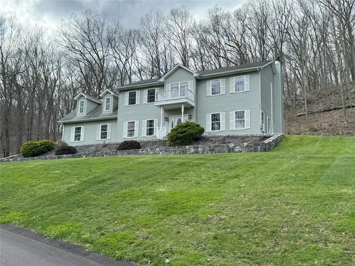 Welcome to this meticulously maintained 4-bedroom, 2.5-bath Colonial home, perfectly situated on a picturesque country road. Designed for both comfort and style, this meticulously maintained property offers everything youâ€™ve been looking for.The heart of the home is the spacious eat-in kitchen, complete with a center island, gleaming granite countertops, and stainless steel appliances. The open layout seamlessly connects the kitchen to a cozy living area featuring a charming fireplaceâ€”ideal for gatherings or quiet evenings in.Retreat to the luxurious primary suite, where youâ€™ll find a tray ceiling, dual walk-in closets, and a spa-like bath with a whirlpool tub and separate shower. An additional room provides versatile space for a home office, gym, or sitting area. Three generously sized bedrooms and a well-appointed full bath offer ample room for family or guests.The oversized garage, equipped with 8-foot doors and 11&rsquo; ceilings, provides excellent storage or workspace options, while the unfinished basement is brimming with potential to be tailored to your needs.Nestled just minutes from the Taconic State Parkway, local hospitals, shopping, and all the attractions of the beautiful Hudson Valley. This home combines convenience with tranquility. Donâ€™t miss the chance to make this exceptional property your own!