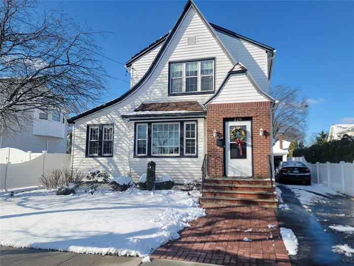 Welcome to this charming Colonial home offering 3-4 bedrooms and 2.5 baths, perfect for your family&rsquo;s needs. The main level boasts an inviting entry foyer that leads to a large living room and formal dining room, both showcasing beautiful hardwood floors. The eat-in kitchen is equipped with a gas stove, dishwasher, and plenty of space for meal prep. A versatile bonus room on this level can be used as a fourth bedroom, guest room, home office, or den. There is also a convenient Half Bath and Mudroom. Upstairs, you&rsquo;ll find three spacious bedrooms and a full bath. The fully finished basement includes a laundry room and offers additional living or recreational space to suit your lifestyle.Outside, the home features fantastic curb appeal on a 50 x 100 lot. The private driveway accommodates up to four cars and leads to a 1.5-car detached garage. The newly fenced yard offers the perfect combination of privacy and functionality, ideal for entertaining guests or simply enjoying quality time with family. A beautiful stone patio adds a touch of elegance, creating the perfect outdoor space for dining, relaxing, or hosting gatherings. Nestled on a quiet private street, this home offers easy access to Sunrise Highway, Southern State, Cross Island and Belt Parkways, and the LIRR is just a short distance away, making commuting a breeze.