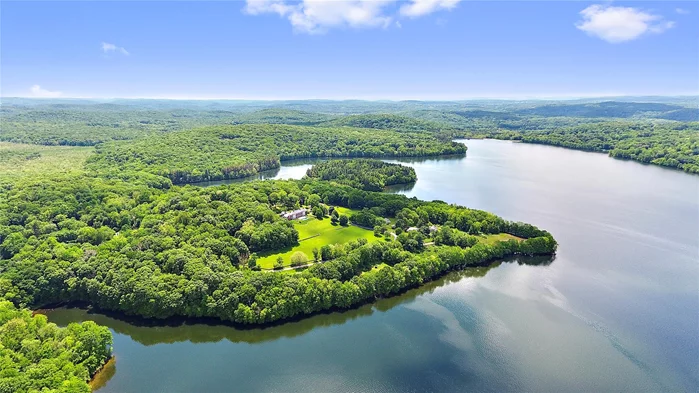 The spectacular Titicus Reservoir and over nine acres are the backdrop to this stunning architectural gem. Completed in 2001 and substantially renovated in 2024, the the house is conceived as open concept. The primary entry hall and all of the public spaces are framed by walls of large windows and doors that face the incredible 180 degree water view. French doors lead out to a sparkling 60-foot infinity edge pool that overlooks the expanse of lawn and the reservoir beyond. 12-foot ceilings, six fireplaces, gleaming wide plank floors, and extensive millwork and built-ins are just a few of the custom elements incorporated into the home. The kitchen, open to the family room, is centered on two islands finished in Calcutta marble. The primary bedroom is outfitted with partnered bathrooms and two walk-in dressing rooms. A first floor guest suite is privately located in its own wing. Just over one hour&rsquo;s drive from New York City, the property is conveniently located within three miles of the charming hamlet of Purdys, the Metro North Train Line and Exit 7 of Interstate 684. Come live the dream in beautiful North Salem!