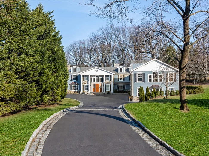 Welcome to 89 Middle Road, a masterfully redesigned Colonial spanning over 8, 300 SF, situated in the prestigious Harbor Acres community of Sands Point, New York. This exceptional residence boasts sophisticated architectural elements, including custom millwork, blonde wood accents on the ceilings, expansive living spaces, and oversized windows that flood the home with natural light.The home features grand entertaining spaces, highlighted by a sunken chef&rsquo;s kitchen with a center island, rich wood cabinetry, and premium thick-cut countertops. Thoughtfully designed for modern living, there is a dedicated homework/crafts alcove, a spacious mudroom with built-in cubbies and a dog wash station, three well-appointed laundry areas, and a fully equipped, matted fitness room.With a total of 8 bedrooms and 11 bathrooms, this home includes a luxurious Primary Wing with a spa-inspired, oversized bath with a soaking tub and two walk-in closets. Each of the home&rsquo;s bedrooms is generously sized, offering ample storage and comfort. The partially finished walk-out basement provides additional living space, featuring a cozy den with a beautiful brick floor, a built-in wet bar, a large playroom, and a bonus flex space.Located at the end of a cul-de-sac and set on a meticulously landscaped 2-acre lot, the property is complete with a saltwater gunite pool with an automatic electric cover, a spacious outdoor slate patio, and a sunken tennis court. As part of the Harbor Acres community, residents also enjoy access to the private Beach Club and clay tennis courts. Conveniently located within the Port Washington Union Free School District, this home offers the perfect blend of luxury and lifestyle.