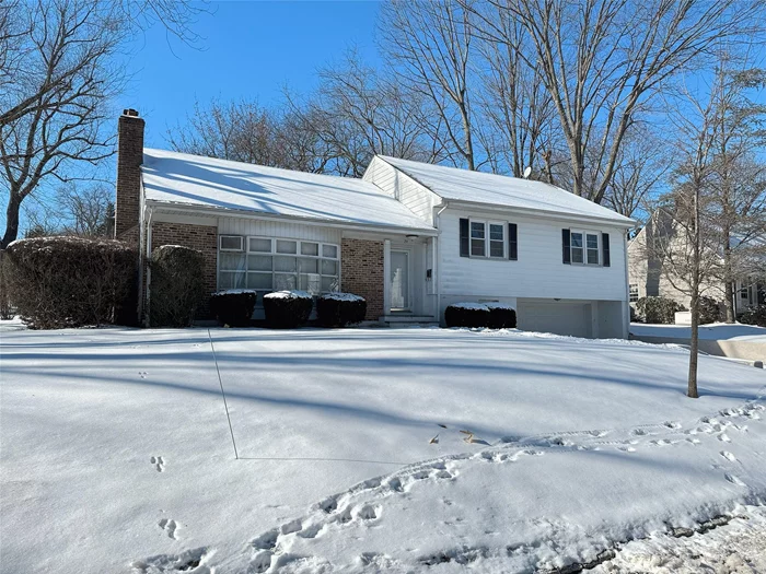 Opportunity to expand or rebuild on this leveled 0.20-acre property in Heathcote section of Scarsdale. Well maintained split-level home featuring a brick fireplace, large bow windows in Living room and Dining area, hardwood floors throughout. Access to the backyard patio through dining room. 2 full bathrooms and 2 car garage. One block to the elementary (Heathcote) school, and less than a mile to Five Corners, Scarsdale swimming pools, park and playground. Commuter bus stop to Scarsdale or White Plains train stations is located just cross the street from the house.