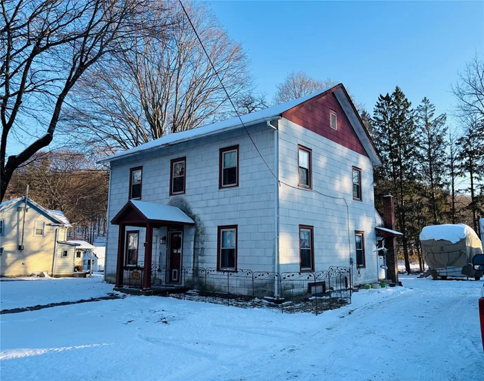 Located at the edge of the town center on about a third of an acre, this 3 bedroom, 2 bathroom colonial style home is waiting for a fresh start. The side entrance from the driveway finds a mud room and laundry room. From there youâ€™ll find a spacious kitchen attached to a nicely sized dining room. Pass through the center hall to a large living room adorned by a gas fireplace. The center hall contains a private full bathroom. Upstairs youâ€™ll find a second full bathroom, three generously sized bedrooms and an office.  What seems to be a closet in the bathroom opens up to two more bonus rooms currently used for storage but could easily be transformed for more living space. An attached, one car garage adds more storage space and entry to the basement. Boiler, water heater, oil tank and central vacuum are all updated. Septic was improved in 2017.