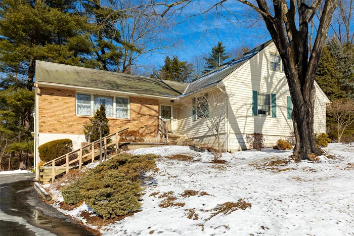 Pretty 4 bedroom, 3 bath cape tucked away on a quiet cul-de-sac in the desired Carriage Hill neighborhood. It boasts over 2, 700 finished sq. ft. Above ground plus approximately 1, 500 sq. ft. full basement. This generously sized former builderâ€™s home offers a beautiful flowing first floor plan with inviting tiled entry, spacious primary suite with large bath & walk-in-closet, 2nd bedroom (or office), full hallway bath, large open eat-in kitchen with ceramic floors, newer appliances, pantry & back door to expansive deck. The sun filled formal living room and dining room have oversized windows, and the laundry/mud room has a separate entrance. The family room features a wood burning fireplace & slider to deck overlooking the picturesque Vassar College woodlands. And this is just the main floor! The second floor features 2 additional bedrooms with vaulted ceilings and hardwood floors - one is oversized and 2 walk-in-closets. They share a full hallway bath and storage closet. The basement is partially finished with great room, storage, mechanicals, workbench & access to 2 car garage. The house also features municipal water, sewer & gas, central air on main floor, blacktop driveway, security system & generator for peace of mind. Great commuter location is minutes away from Rt 9, Metro North trains, restaurants, Vassar college, shopping & hospitals. Arlington Schools. The size and layout of this home afford limitless opportunity to make it your own.