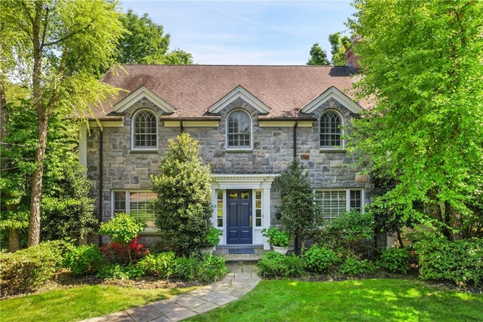 Handsome stone front center hall Colonial located on a distinctly beautiful street among the most coveted estates in Westchester. This young and beautifully updated home boasts classic detailing, sun-filled rooms, and a fabulous flow for living and entertaining. A gracious entry foyer with gleaming hardwood floors leads to a formal living room with marble fireplace, formal dining room with elegant millwork and moldings, cozy home office with built-in desk, first floor bedroom with full bath, mudroom area, and a brand new powder room with a stunning marble floating vanity sink. The heart of the home is an especially chic new custom kitchen (2020) with a Calacutta Paonazzo marble slab center island, new chefâ€™s appliances, and sleek custom bar with refrigerator drawers. The oversized eat-in kitchen directly opens to a spacious and inviting family room outfitted with built-in custom cabinetry and french doors to the wonderful bluestone patio and park-like and level backyard, lush with mature landscaping and gardens, perfect for al fresco dining and enjoyment. Upstairs, the second floor has a huge primary suite with 3 exposures overlooking the verdant grounds, two large outfitted closets and a spa-like ensuite bathroom. 4 additional bedrooms and 2 full baths complete this floor, and the lower level includes a large rec room and laundry room. While 100 Garden Road feels worlds away, it is just minutes from Scarsdale and Hartsdale shopping, dining, and golfing, with easy access to parkways, the Metro North station, and top-rated schools. A truly exceptional offering.