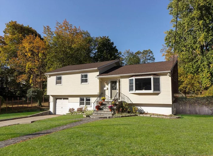 Centrally sited in the Village of Dobbs Ferry - just minutes from downtown - this should be your first stop when looking for a peaceful, pristine residence. Itâ€™s sited on a versatile quarter acre property located in a quiet cul-de-sac, with a granite cobblestone-lined driveway where one can enjoy vistas of the grounds of the Ardsley golf course at the apron of Pietro Place. This bright, pristine home with hardwood floors and central AC offers plenty of opportunities for whatever lifestyle you choose. The open-concept entry level feels bright and welcoming, with a large living room looking onto a level front lawn through a wide bay picture window. Awash in sunlight is the renovated kitchen/dining area, where French sliders allow the interior to expand out onto a new, spacious composite deck offering opportunities for outdoor meals and gracious entertaining, as well as summer fun in a sizeable pool off the deck level. The homeâ€™s generous kitchen contributes to the easy flow throughout the home and includes stainless steel appliances, granite counters, tile floors and backsplash, and pass-thru counter. Work at the sink while gazing beyond the private backyard to find a sweep of bordering trees and an expansive sky above. Ascend a few stairs to 3 sun-soaked bedrooms with wood floors and skylit tile bath. A sizable primary offers two beautiful backyard exposures and a pair of double-wide California closets. Discover a cheerful family room on a walk-out lower level with tile floor, powder room, and glass sliders to a delightful fenced-in yard. From here, access a large paved patio, step up to the new deck, pool, and enjoy a broad expanse of grassy level yard beyond, or do some planting in a raised area at the back boundary, edged by a lovely stone retaining wall. An attached garage completes this level. As an added bonus, a basement affords ample storage space, a laundry area, and a finished space for home-office or studio. Ideal location with golf course at the north end of the street, town park and pool at the south, award-winning schools a block away, and a vibrant village downtown just beyond that. It is all at your fingertips, including a beautiful 40-minute Hudson River train commute to GCT. Come see for yourself.