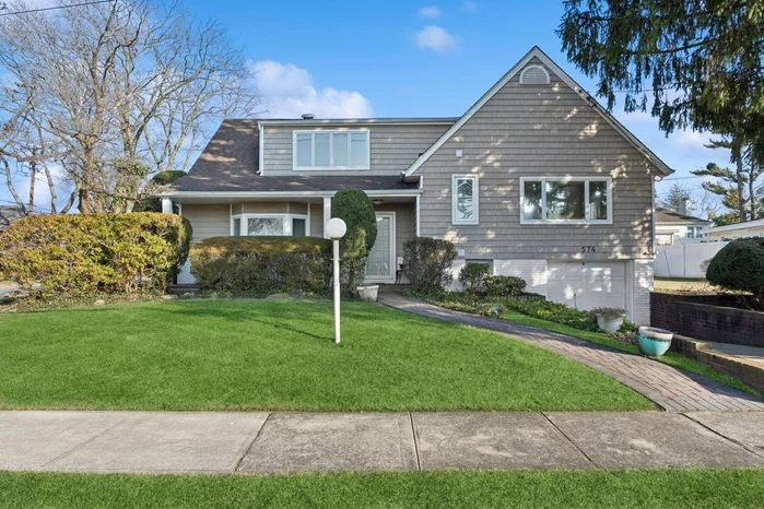 Welcome to 574 Norman Way! This updated 4-bedroom, 2-bath split-level home is perfectly situated in the highly desirable Saddle Ridge section of Woodmere. This home offers a thoughtfully designed layout with plenty of space for both everyday living and entertaining. The bright, open living area provides an inviting atmosphere, while the spacious kitchen effortlessly flows into the dining room, making meal preparation and family gatherings a breeze. Upstairs, you&rsquo;ll find four generously sized bedrooms, including a primary suite with its own private bath for ultimate comfort and privacy. The lower level features a cozy family room, ideal for relaxing, entertaining, or multi-generational living. Outside, enjoy your own private retreat with a stone patio, perfect for summer BBQs, unwinding, or simply taking in the peaceful surroundings. The expansive corner lot provides ample yard space, offering both privacy and room for outdoor activities. Conveniently located near shopping, dining, schools, and transportation, this home offers the perfect balance of comfort, style, and location.