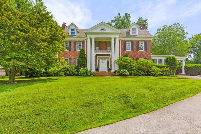 Majestically situated atop a long, tree lined driveway you&rsquo;ll find one of White Plains&rsquo; most iconic homes. This Classic Brick Colonial home seemingly blends the architectural details of the 1920&rsquo;s with the modern amenities conducive to today&rsquo;s lifestyle through it&rsquo;s recent and total interior renovations. Enter into your elegant Grand Foyer or Porte-Cochere to experience the beauty of the grand rooms. The 1st floor boasts a new, custom Kitchen with Center Island, coffee bar, new appliances and is open to a sun drenched Breakfast Room/ with French Doors out to your stunning Patio and Pool A Butler&rsquo;s Pantry connects the Kitchen to your formal Dining Room w/FPL that leads to one of 2 Sun Rooms. A spacious Living Room, with your 2nd Sun Room/Solarium directly connects to a fabulous Family Room overlooking the backyard, a mudroom near your side door and a gorgeous new Powder Room complete this amazing first floor. The 2nd floor Primary Suite will exceed all of your expectations with enormous closet space and a new Primary Bathroom Suite suited for a relaxing, zen like spa experience. Bedrooms 2 & 3 have a new Jack & Jill Bath, Bedroom 4 is sunny & bright and Bedroom 5 is larger than most Primary Bedrooms with a new full bath nearby. The new Laundry Room is conveniently located on the 2nd floor, putting everything you need at your fingertips. The 3rd floor hosts amazing bonus space and is the perfect place for a home theatre, office or playroom. The backyard is a private oasis with a beautiful pool & patio that makes this home perfect for entertaining or relaxing. More than enough room to build a garage, host massive parties or just enjoy the solitude of your own home.