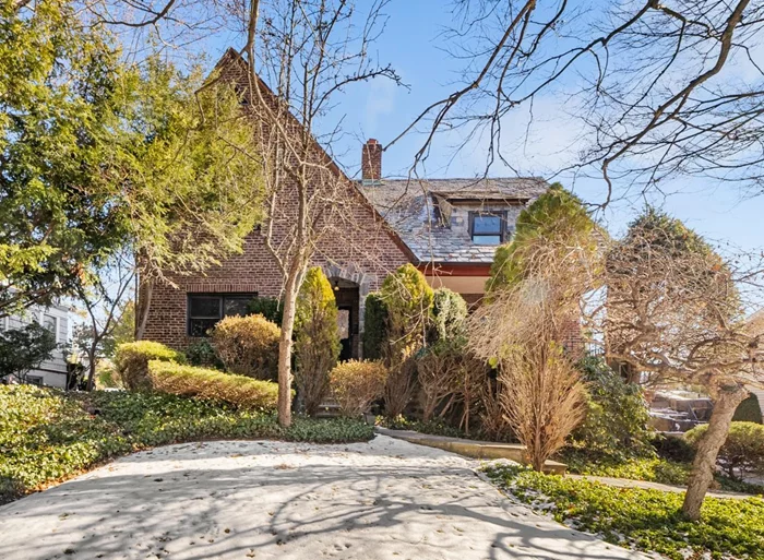 Masterfully constructed all brick and stone Tudor style home in Bryn Mawr Knolls. This home boasts exceptional construction, slate roof, beautiful archways, and so much more! As you walk through the front door you immediately know you are someplace special. Original oak floors running through the home, original doors and mill work welcome you and let you know you are in a well-built, solid space. Large living room with fireplace and two doors out, one to the front covered porch and the other to the backyard, great for entertaining. Formal dining room, eat-in kitchen, laundry, half-bath and office complete this level. Primary suite with private bathroom and walk-in closet, two large additional bedrooms that overlook the property and share a full hall bathroom with tub/shower make up the second. Walk-up attic with tons of versatile alternatives. The lowest level provides a bonus room option with access to utilities and garage or simply to walk outdoors. The house was a private commission by Norman Dayton Richardson, one of the first Port Authority engineers. Richardson worked on the George Washington Bridge and there is a rumor that when the Depression hit and construction stopped on the bridge, Richardson brought several workers to the house build to give them work. The neighborhood itself was designed by Frederick Law Olmsted, who with Calvert Vaux designed Central Park. So much history within these beautiful walls. A truly special home and a must-see. Bus on Palmer road to Bronxville Train Station and Village.