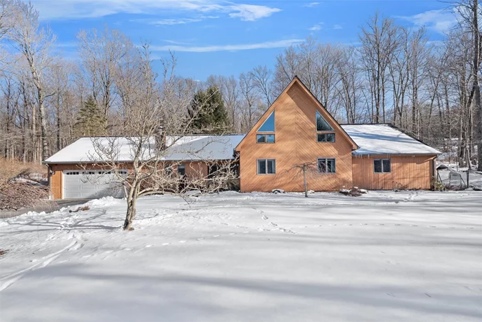 Welcome to this open, bright and spacious contemporary ranch on the top of a hill overlooking the mountains. On a clear day....WOW the views here are incredible.  This house is special with an Adirondack feel and high-quality construction including soaring ceilings, exposed beams, open floor plan and more. The living room features a wall of windows and a stone fireplace with a thermostat regulated pellet stove, wood floors and beautiful built-ins. The kitchen is updated and features stainless steel appliances. One floor living is luxurious and convenient with everything you need easily accessible to you.  Enjoy an oversized primary bedroom with renovated bathroom, jacuzzi tub and stand-up shower. Perhaps one of the greatest features of this home is the spacious loft which can be used as a play room, gym, studio, office, lounge, game room and more. The property consists of 12 acres wonderful for trail blazing, hiking, hunting and simply having your own, private, sprawling, wooded land. Close to major shopping and restaurants. Easy NYC commute by car, bus or train. Enjoy! And hurry...this won&rsquo;t last.