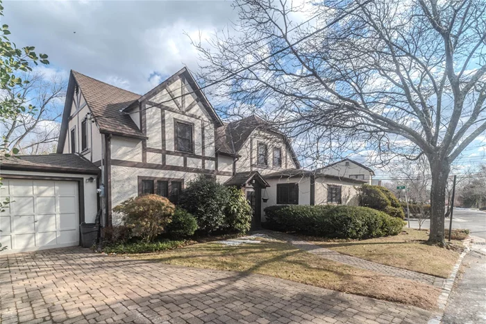 Nestled on a rare 10, 345 square-foot corner lot in the prestigious Douglaston area the stunning 1930-build home offers 2, 340 sq ft. of elegance and charm. Featuring three spacious bedrooms, 2.5 baths, a large living room with a cozy fireplace, a bright den, and a formal dining area, this property is perfect for both relaxation and entertaining. The Eat-in-kitchen adds warmth to family gatherings, while the pulldown attic and unfinished basement provide ample storage and future potential. Modern comforts include central air conditioning, gas heating, and attached garage, and inground sprinklers to maintain the beautifully landscaped yard. Electric has been upgraded to 150 amps. Complete with a sparkling and ground pool, this home is an oasis in a prime location.