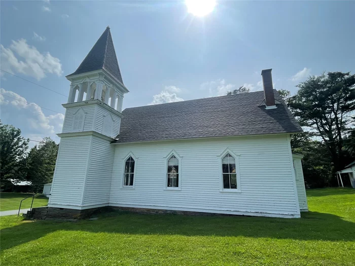 Gorgeous church built in 1892...On the National Registry of Historic Places. Original tin walls and ceilings, chandeliers, kerosene lamps, wood burning stoves, pews, pulpit and pump organ. Roof is fairly new on both structures. Second structure is an out building with concrete floors, shiplap walls and ceilings, with electricity, water, and septic. Has not been used in years. Kitchen and bathroom need renovating. Sold AS IS. Great space, so much history! Come see it and imagine what its next chapter in life can be!Listing agent has special interest in property.