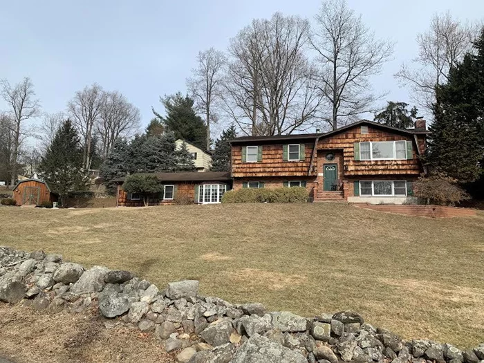 What an amazing high ranch style home with wood and brick siding in the heart of historic Stony Point, New York! As you enter this amazing home, you will first enter to the upper level, and you will walk into a very spacious kitchen. Then you can walk out to a fabulous deck and a one-of-a-kind gazebo that is right off the kitchen. You will then walk into a very nice size dining room, and an open living room. As you continue to make your way down the hall, you will find three bedrooms and two full bathrooms, in which one bathroom is in the master bedroom. Next, you will make your way to the lower level of this amazing high ranch. When you enter the lower lever, you will walk into a den area. After walking through the den, you will walk into one bedroom. The family room on this amazing lower level you will find a very nice size fireplace. We cannot forget about the spacious sized finished laundry/utility room. Oh and what a nice BONUS room. When you turn the corner, yes you thought it, there is a half bathroom. This high ranch home also features a two car, built-in garage with an attic above. Please do not walk, you need to run to see this high ranch in the heart of Stony Point, NY!