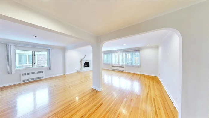 This charming and fully detached single family home, nestled in the desirable Rego Park Crescents, is a rare gem on an expansive 48&rsquo; x 115.58&rsquo; irregular lot. Boasting a prime location just moments from top-tier shopping, dining, and excellent schools, this residence offers both convenience and tranquility.Inside, the home showcases beautifully restored hardwood floors and elegant architectural details. The spacious living room, complete with a cozy fireplace, sets the perfect ambiance for relaxation. A well-appointed separate kitchen with a breakfast corner area enhances the home&rsquo;s warmth and functionality. The main level features three generously sized bedrooms and a full bathroom, with easy access to a serene and private backyardâ€”ideal for unwinding after a busy day in the city.The property also includes a fully finished basement with a separate entrance, offering additional living or entertainment space. Completing this exceptional home is a one-car garage, ensuring added convenience.This is a must-see opportunityâ€”donâ€™t miss the chance to make this stunning home yours!