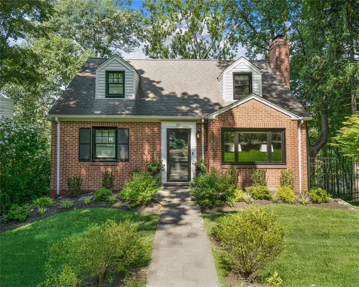 Exquisitely updated red-brick cape cod in award-winning Hastings school district will captivate you. Newly installed Pella Reserve black trim windows bestow a chic, contemporary accent to the classic red brick exterior, beckoning you to the stunning spaces within. From the foyer, view through an attractive archway the heart of the home...the open-concept living/family room, dining room and kitchen exuding a wonderful light, breezy and stylish ambience lent by the front-to-back sight lines, multiple exposures, and pop of the black-trimmed windows. Add the wood-burning fireplace that anchors the living/family room for gathering on those cold winter nights and the picture is complete! Accessible through the kitchen or hallway is the first floor full bathroom tastefully renovated with Kohler Modern Brass fixtures, crisp white ceramic wall tiles, and porcelain floor tiles. Two roomy bedrooms (each with double exposures and closets) round out the first floor, but either can be used as office or playroom...a versatile floor plan! Ascend to second level where two family bedrooms, a full bathroom, and a spacious primary bedroom that offers spectacular tree-top sunset views are found. Below, on the lower level is an expansive, inviting family room, updated powder room/laundry, and a mud area with walk out to a verdant, private backyard with patio. This large property is comprised of two tax lots, with the house situated on one fully fenced-in, picturesque lot and the adjoining vacant lot a blank canvas for house expansion or sale. Conveniently located near shopping, major highways, and public transportation. Greenburgh & Hastings recreation and Hastings Metro North resident parking eligible. Impeccably maintained, turn-key home offers it all. Taxes are prior to STAR.