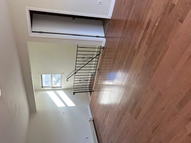 Spacious Second-Floor-Three Bedroom, One-And-A-Half Bath Rental Featuring: Lustrous Hardwood Floors and Freshly Painted Interior. Conveniently located just Minutes From LIRR, Transit, Shopping Mall, Dining and Airport-Offering Both Comfort and Accessibility