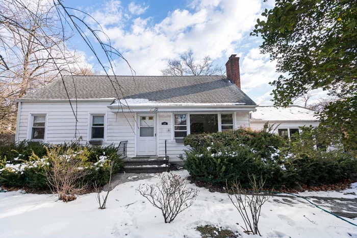 This beautifully expanded Cape Cod offers a perfect blend of comfort and functionality. Situated on an oversized property, this home features hardwood floors and a spacious layout. Great Taxes!Inviting Living Room: Cozy up by the wood-burning fireplace.Converted Two-Car Garage: Transformed into a large family room, perfect for gatherings.Flexible First-Floor Bedroom/Office: Features sliding glass doors leading to a deck and private fenced backyard.Two Full Bathrooms: Conveniently located for easy access.Outdoor Enjoyment: Fully fenced property ensures privacy, ideal for relaxation or entertaining.A wonderful opportunity to own a home with charm, space, and versatility!