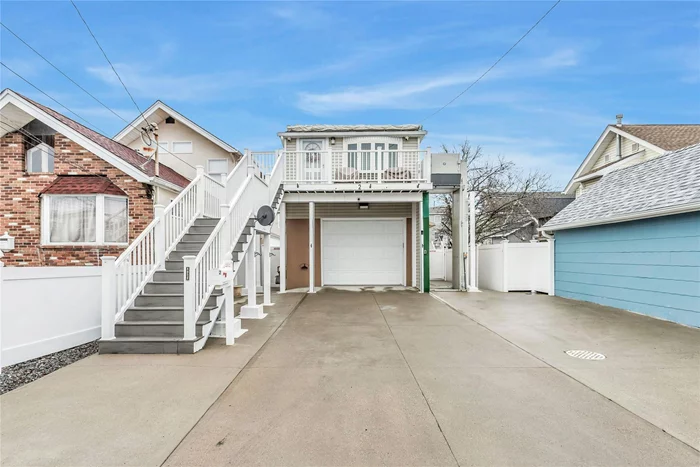 This renovated gem, updated in 2022, is just a block from Bay Park, offering exclusive access to the Bay Park Civic Association and dock rights on the Grand Canal. The home boasts a modern kitchen with custom cabinetry, gleaming granite countertops with ogee edging, gas cooking, and durable porcelain tile floors. A spacious bedroom features dual closets and a pull-down attic staircase, leading to a full attic with lighting and flooring for extra storage. The den and dining area feature porcelain tile, while the bathroom showcases a standing tiled shower and vanity.Additional highlights include, an outdoor elevator, a brand-new open cement foundation with a two-car garage with keypad entry, epoxy finished floor, and a 2.5-ton Fujitsu ductless air and heating system for year-round comfort. The multi car driveway easily fits 4 cars. The home is equipped with 200-amp upgraded electric, a Kohler whole-house backup generator, a brand-new Timberline 30-year architectural roof, a tankless A.O. Smith on-demand water heater, a separate tankless on-demand boiler, and two additional 2 Ton Fujitsu Ductless A/C & heat Units. Electric Service, Sewer, Water and Gas Lines are all brand new. Outside, an electronic awning extends over the front Trex deck, perfect for enjoying the outdoors and sunsets. For peace of mind, the property also comes with a state-of-the-art home surveillance system, complete with eight HD cameras and an NVR center.It&rsquo;s the perfect blend of easy life, functionality, and coastal living! Move right in, there is nothing to do.