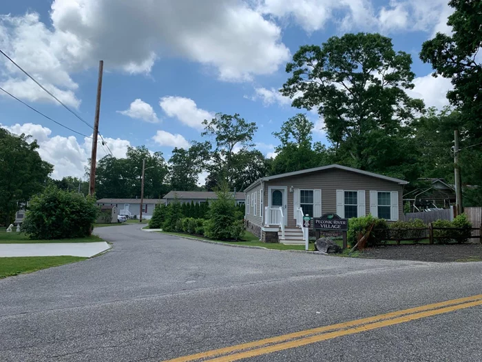 WELCOME TO PECONIC RIVER VILLAGE. A MOBILE/MANUFACTURED HOME COMMUNITY LOCATED RIGHT ON THE PECONIC RIVER. THIS 2019 PINE GROVE MANUFACTURED HOME HAS 3 BEDROOMS, 2 BATHS, OPEN FLOOR PLAN WITH LR DR & KITCHEN. A LAUNDRY ROOM WITH UTILITIES AND WASHER DRYER. FRONT PORCH, SIDE DECK, 3 CAR DRIVEWAY. CAC, SPRINKLER SYSTEM - PROPANE HEAT HOT WATER AND COOKING! Total Maintenance with real estate taxes are $930.92 per month, Additional information: Appearance:DIAMOND, Green Features:Insulated Doors, Location Features:Protected Wetland, Separate Hotwater Heater:Y