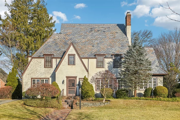 Situated on an expansive and private 75 x 150 property on one of the Village of Garden Cityâ€™s most picturesque streets, this elegant Normandy Tudor is characterized by a stunning slate roof and stately exterior. The interior of the home features large rooms with high ceilings, hardwood floors, and classic moldings. Built in 1927, this home offers over 2700 square feet of living space, with many original architectural features still intact. An impressively sized Living Room w/ fireplace, a Formal Dining Room, a Sun Room, Eat-in-Kitchen, Maids Room and Full Bath comprise the 1st Fl. The 2nd floor features 4 Bedrooms, including a Primary Bedroom with an Ensuite Bath and Dressing Room. This is a home to love and cherish for years to come. Create your own story at 27 Chestnut Street!