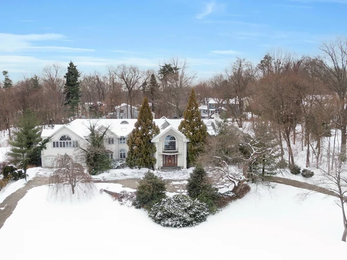 Transform This Grand Estate into Your Dream Home! Set on just under 3 acres in a desirable cul-de-sac, this expansive residence offers over 10, 000 sq. ft. of bold, sunlit living space. With 7+ en suite bedrooms, soaring high ceilings, and an elevator servicing all three floors, this home is designed for grandeur living. The impressive open kitchen, butler&rsquo;s pantry and formal dining room is perfect for entertaining. There is office space and den options as well as a first floor oversized en suite bedroom. The unfinished walk-out lower level and above the three car garage area offers endless opportunities to customize and expand your living space.This home is a perfect canvas for those looking to infuse their own style and love into a property, transforming it into a magnificent family estate. Seize the opportunity to create your dream home today!