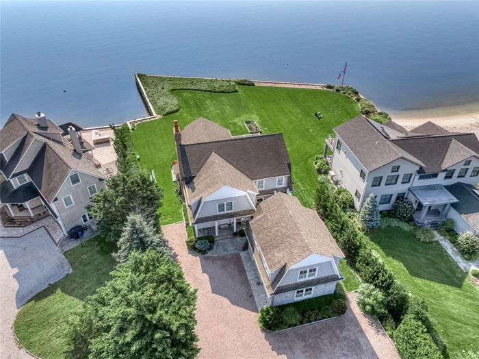 Indulge in luxurious comfort at this exceptional South Jamesport Bayfront home. This five-bedroom, five-bath estate on an acre of prime waterfront land is the ultimate retreat for those seeking the best in high-end living. As soon as you enter, be captivated by the breathtaking panoramic views of the Peconic Bay through the floor-to-ceiling windows. Elegant moldings and custom built-ins complement the open floor plan, connecting the great room, featuring a cozy fireplace and coffered ceilings, with the gourmet kitchen equipped with top-of-the-line Sub Zero and Wolf appliances. The second-floor primary suite, complete with sliding door opening to a bay-viewing deck, provides a lavish sanctuary while four additional bedrooms offer ample space to unwind. This property truly has it all and is move-in ready. Don&rsquo;t let this chance to fulfill your waterfront dreams slip away. Experience the exceptional by checking out our attached video and floor plans for more information. Appearance: Diamond++