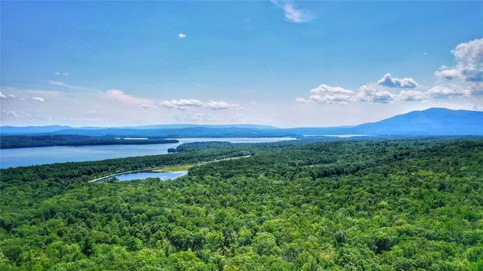 Magnificent views of the Ashokan Reservoir are possible with clearing from this 24.3-acre estate lot, which borders protected lands. The property offers multiple secluded building sites and a septic design for a 4-bedroom house in the location with the best view. This is a AAA location suited for use as an estate lot, but with A-4 zoning and frontage on both Walton&rsquo;s Road and Boyce Road, subdivision to offset expenses or for speculation building is a great option. This is a rare opportunity to purchase in a sparsely populated gated community of fine estates, surrounded by thousands of acres of protected land. Optional* membership in the Tonche Association grants access to hundreds of acres of private land, hiking trails, a private swimming hole, Kenozia Lake with a boathouse and picnic area, and a stunning lookout tower offering 360-degree panoramic views of the Ashokan Reservoir, Hudson Valley, and the Catskill Mountain Range. Be sure to watch the drone footage in the virtual tour! Private roadâ€”NO drive-bys. Proof of funds required prior to confirming appointments