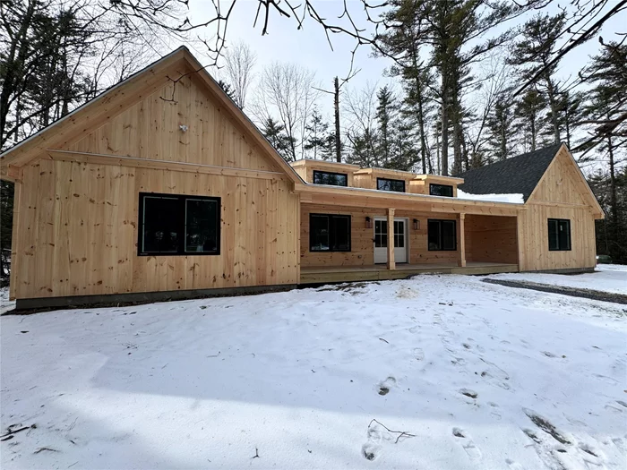 Nestled in the heart of the Hudson Valley, this stunning, nearly new construction home blends modern design with rustic charm. Thoughtfully positioned at the rear of the lot for maximum privacy, this 1, 925 sq ft retreat is surrounded by towering trees, offering a peaceful woodland escape while still being close to Kingston and Stone Ridge.Step inside and be greeted by a breathtaking great room, where soaring cathedral ceilings,  and skylights fill the space with natural light. A custom fireplace with built-in shelving creates a cozy focal point, while hardwood floors flow throughout the open-concept living area. French doors lead out to a covered front porch, perfect for enjoying your morning coffee while listening to the sounds of nature.The well-appointed kitchen is designed for both function and style, featuring sleek white cabinetry, black pendant lighting, and ample counter spaceâ€”a perfect setup for entertaining.The primary suite is a true sanctuary, offering a spa-like ensuite bath with a double vanity and tranquility. A second bedroom provides a comfortable guest space, while the large office/den offers flexibilityâ€”ideal as a home office, media room, or even a potential guest space.With thoughtful craftsmanship and high-quality finishes throughout, this home is a rare find in a sought-after location. Whether youâ€™re looking for a full-time residence or a serene weekend escape, this property is ready to welcome you home.Schedule a private showing today!